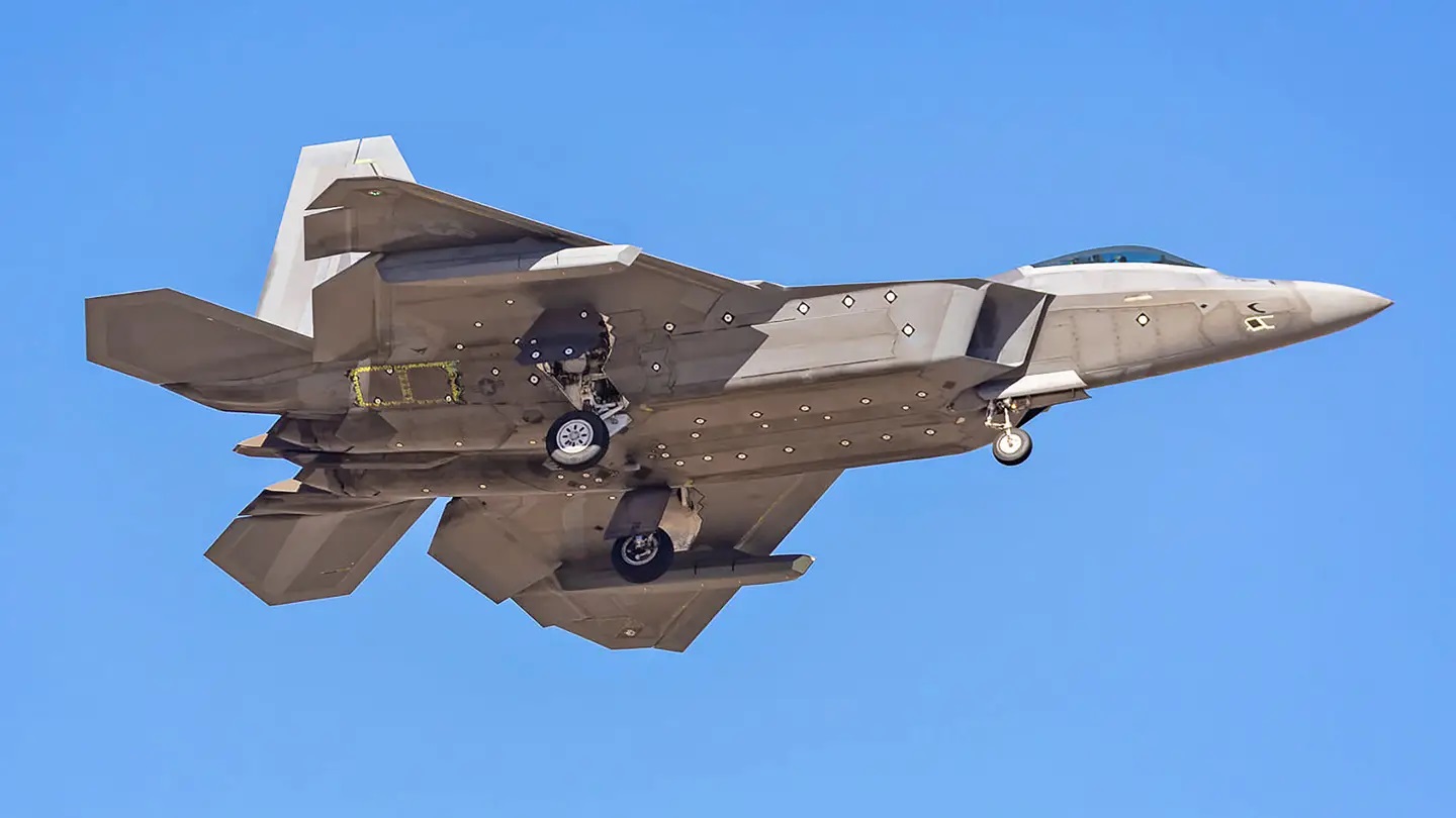 F-22 with mysterious stealthy RF or optical pylon sensor.jpg