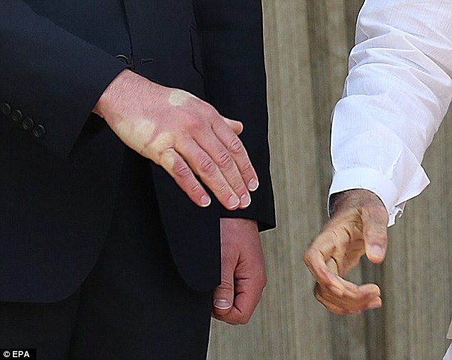 Now THAT'S a firm handshake! Indian prime minister leaves a palm print on Prince William as he...jpg