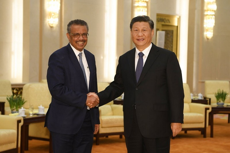 China's Xi Jinping (right) with WHO chief Tedros  