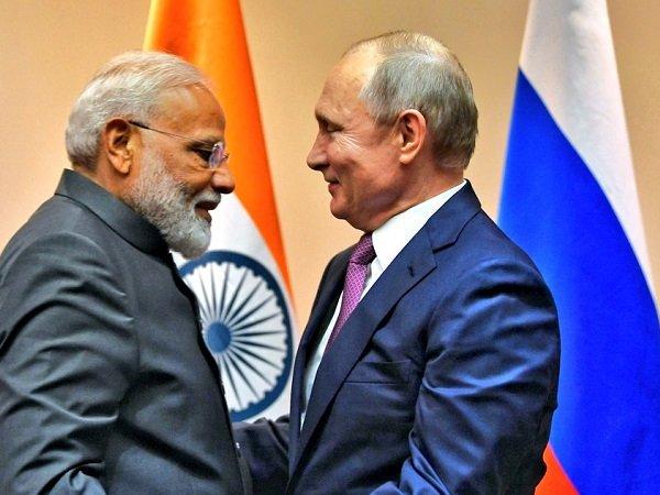 1563210612-Putin_Modi_SCO_Raveesh.jpg